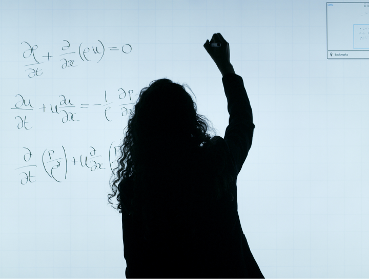 woman drawing on whiteboard